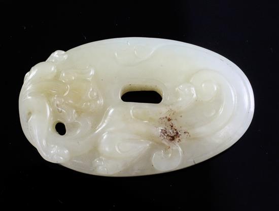 A Chinese archaistic white and pale russet jade oval disc, 4.9cm